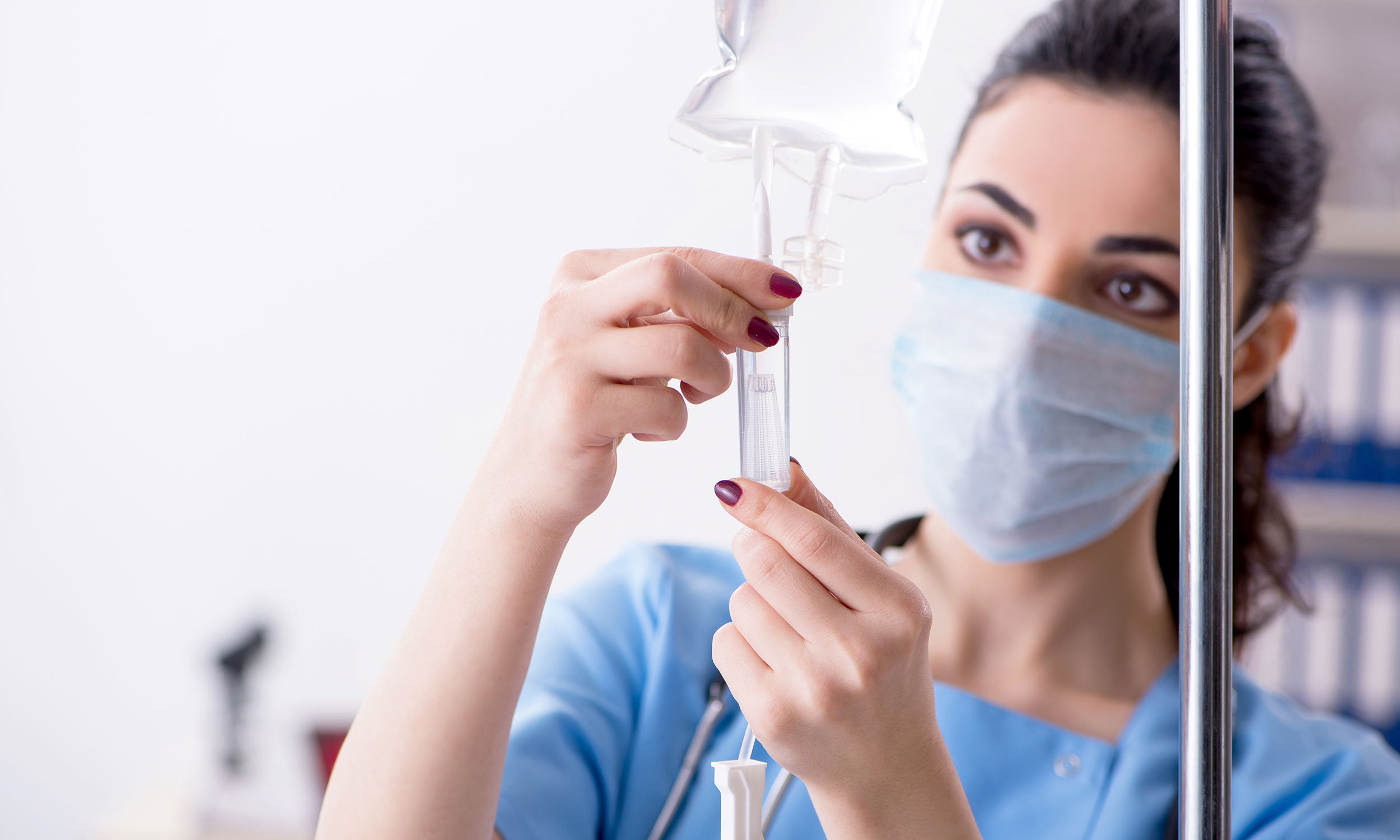 Woman checking an IV